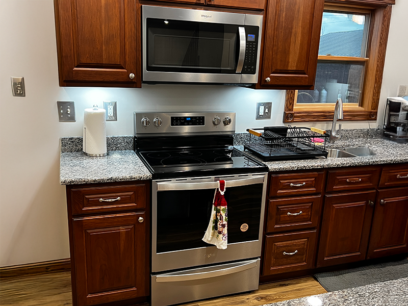 oven Steel oven and microwave in a kitchen.